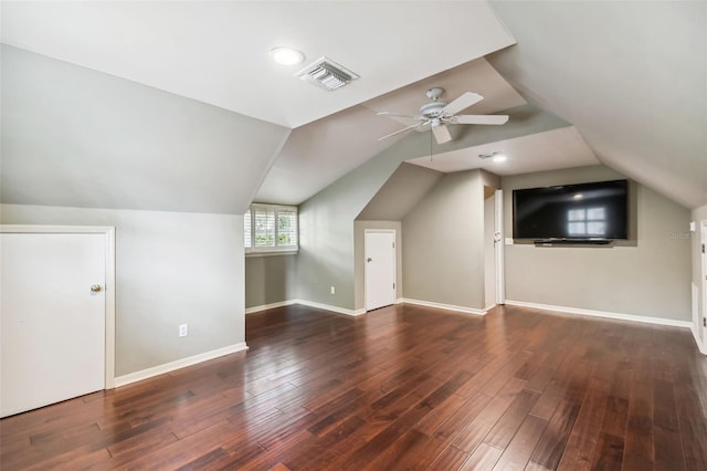 bonus room featuring dark hardwood / wood-style flooring, lofted ceiling, and ceiling fan