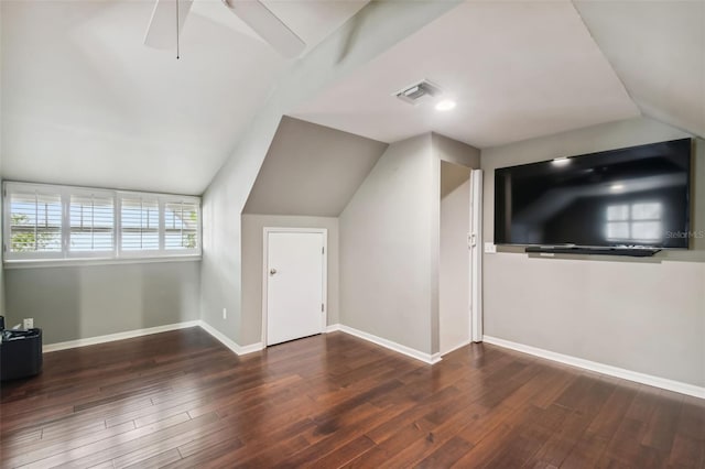 bonus room with lofted ceiling and dark hardwood / wood-style floors