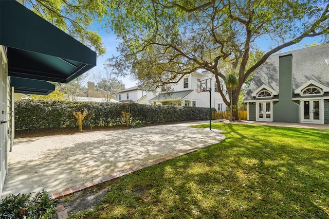 view of yard featuring french doors