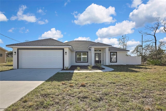 view of front of home with a garage, concrete driveway, fence, a front lawn, and stucco siding