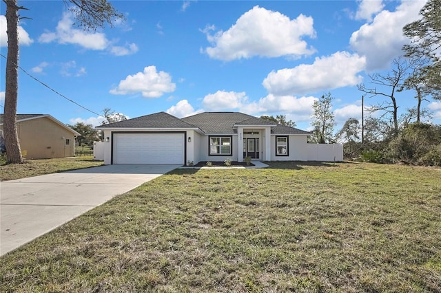 view of front of property featuring a garage, concrete driveway, a front lawn, and stucco siding