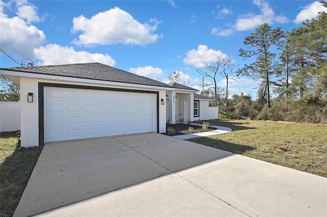 ranch-style house featuring a front yard, concrete driveway, an attached garage, and stucco siding