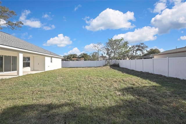 view of yard with a fenced backyard and a patio