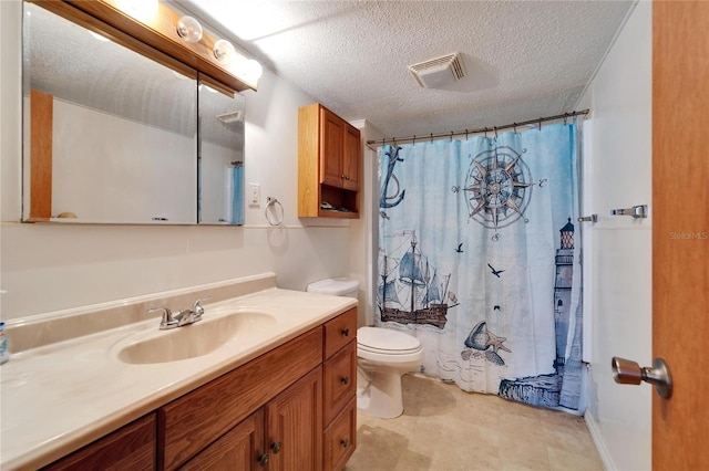 bathroom with vanity, toilet, a shower with shower curtain, and a textured ceiling