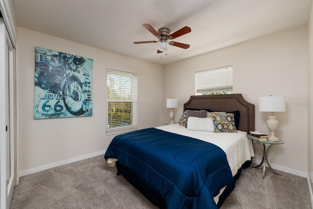 carpeted bedroom featuring ceiling fan