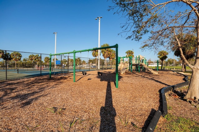 view of playground featuring tennis court