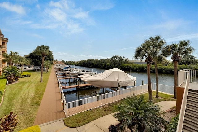 dock area featuring a water view and a lawn