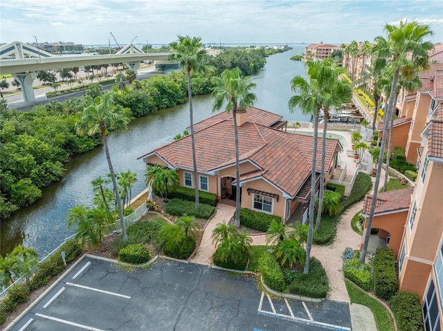 birds eye view of property with a water view