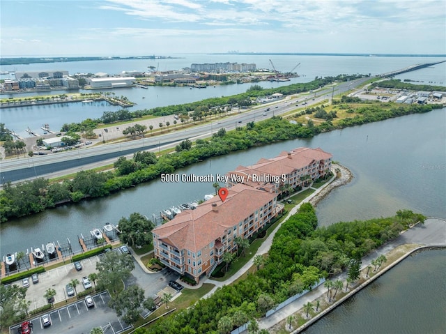 birds eye view of property featuring a water view