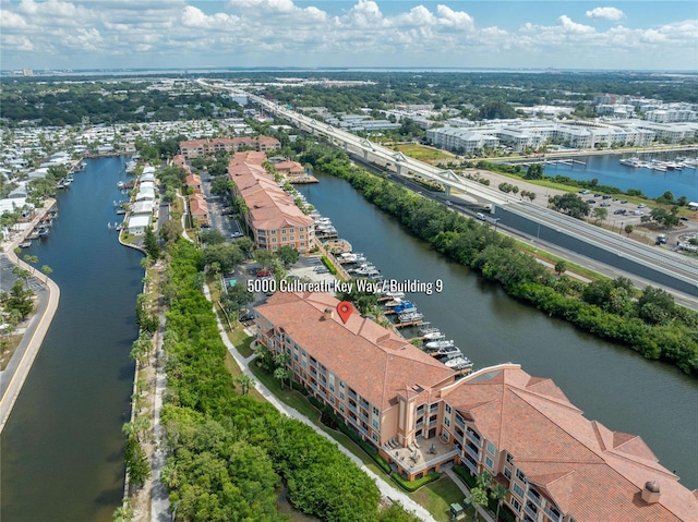 drone / aerial view featuring a water view