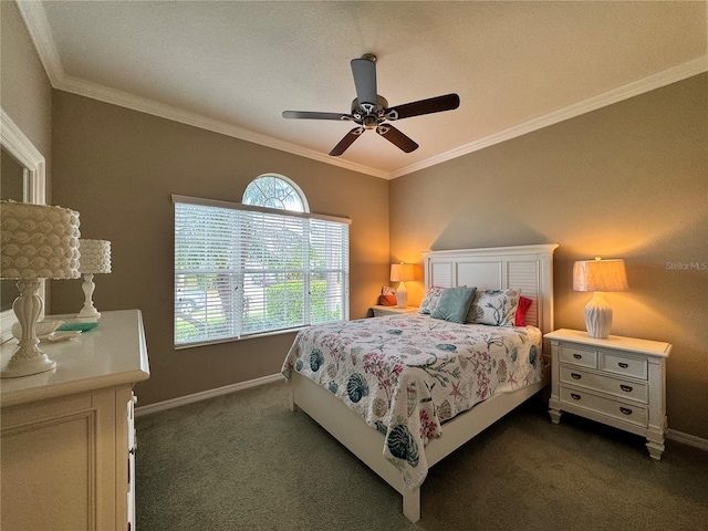 bedroom featuring dark colored carpet, ornamental molding, and ceiling fan