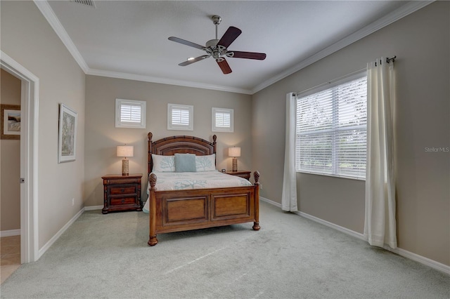bedroom featuring light colored carpet, baseboards, ornamental molding, and a ceiling fan