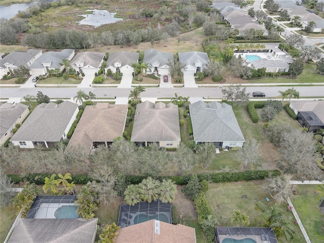 birds eye view of property with a residential view