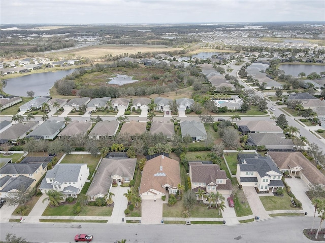 bird's eye view with a residential view and a water view