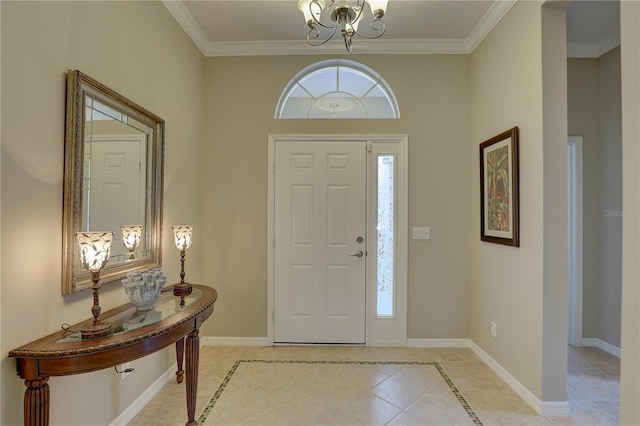 entrance foyer with crown molding, baseboards, a chandelier, and light tile patterned flooring
