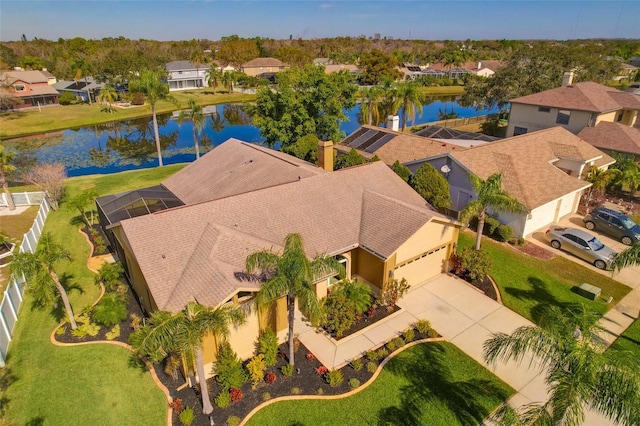 bird's eye view with a residential view and a water view