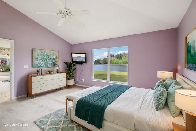 bedroom with light carpet, baseboards, vaulted ceiling, and a ceiling fan