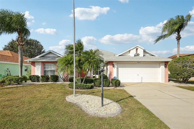 single story home featuring a garage, a front lawn, concrete driveway, and stucco siding