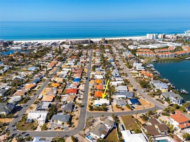 drone / aerial view featuring a water view and a residential view