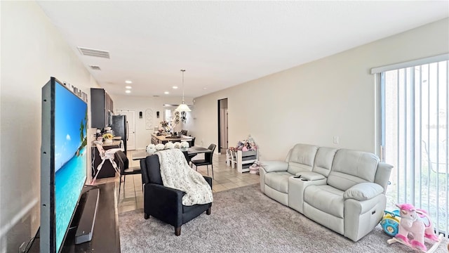 9362 Oglethorpe Dr, Groveland, FL 34736 - living room with light colored carpet and recessed lighting