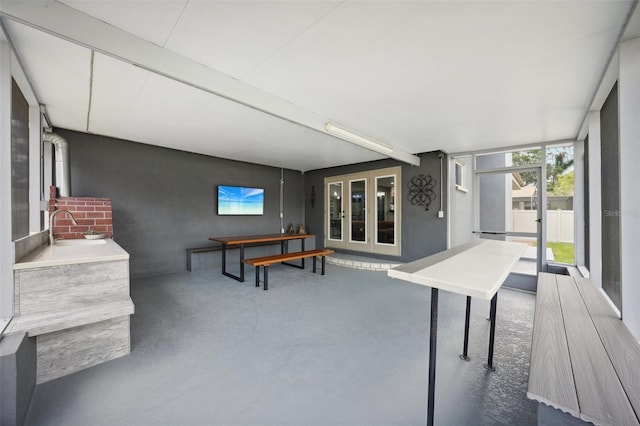 interior space with french doors and sink