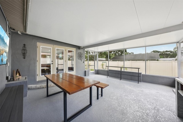 sunroom / solarium featuring french doors