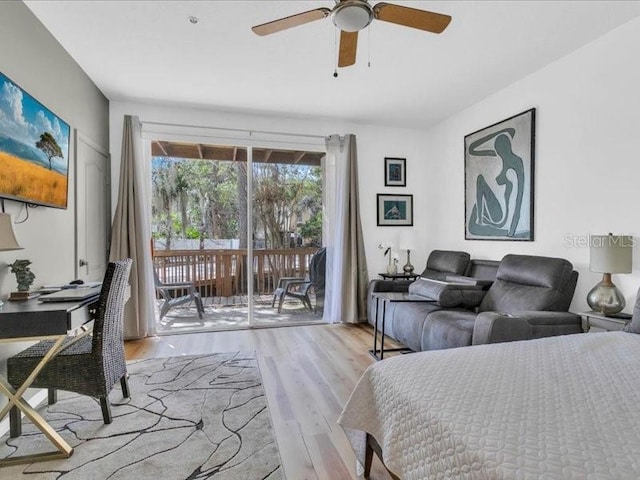 bedroom with access to exterior, ceiling fan, and light hardwood / wood-style flooring