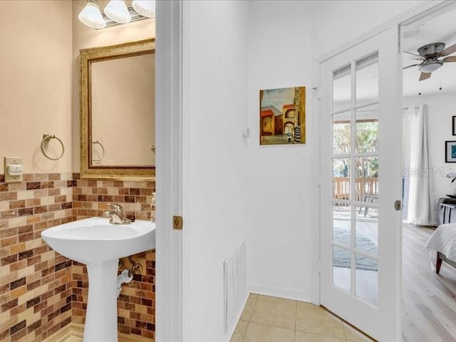 bathroom featuring tile patterned floors and ceiling fan