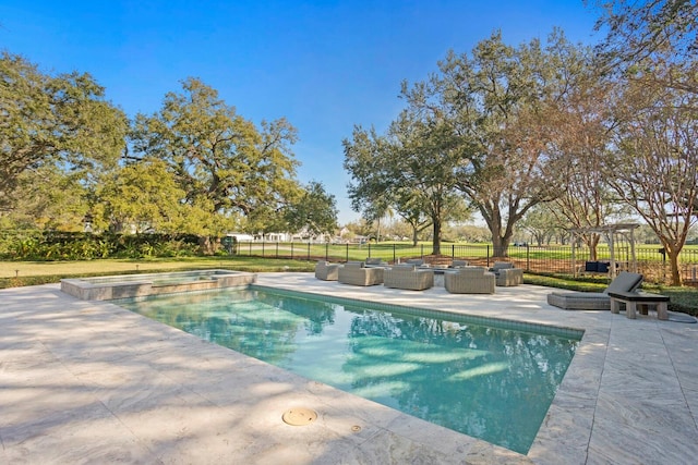 view of pool featuring a patio and outdoor lounge area