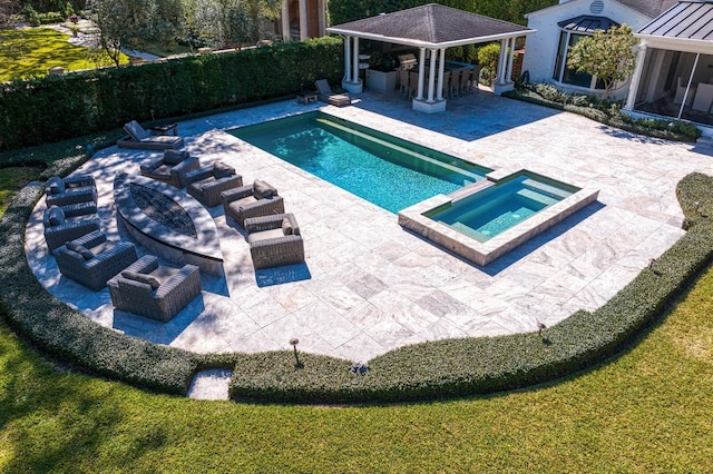 view of pool with a gazebo, an outdoor bar, an in ground hot tub, an outdoor living space, and a patio