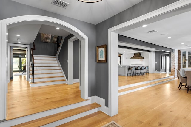 stairway with wood-type flooring