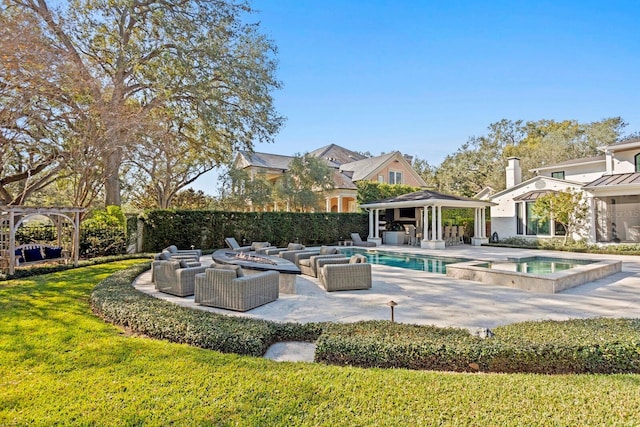 view of swimming pool featuring a fire pit, a yard, a gazebo, a patio area, and an in ground hot tub