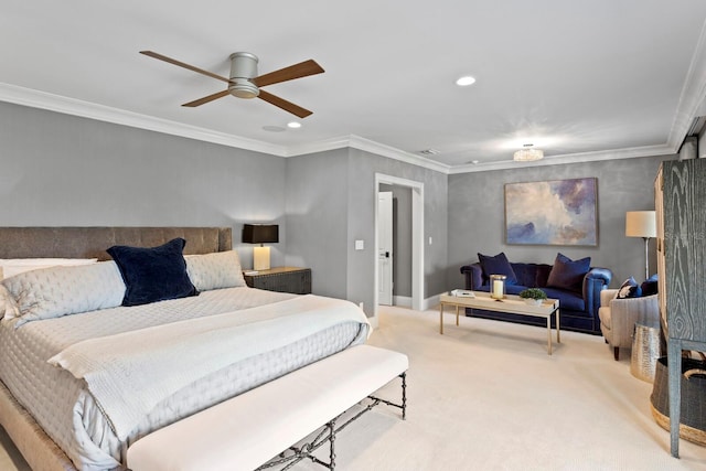 carpeted bedroom with ornamental molding and ceiling fan