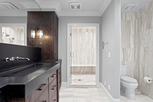 bathroom featuring crown molding, toilet, sink, and a shower