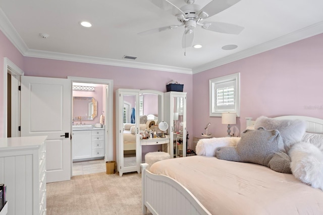 carpeted bedroom with ornamental molding, sink, ensuite bathroom, and ceiling fan