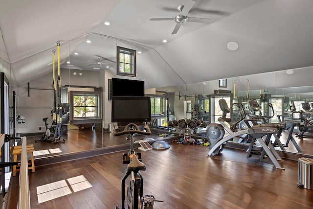 workout area with dark wood-type flooring, ceiling fan, and high vaulted ceiling