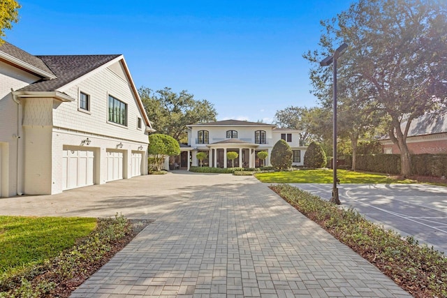 view of front of house with a garage and a front lawn