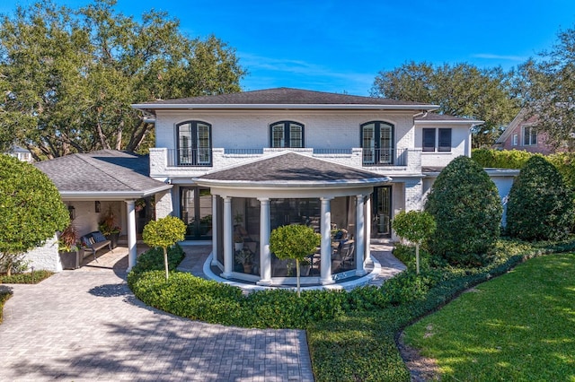 back of property with a balcony