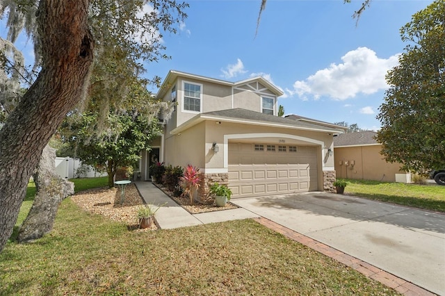 view of front of house with a garage and a front lawn