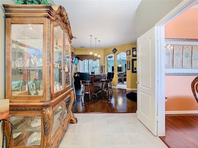 tiled dining room with baseboards