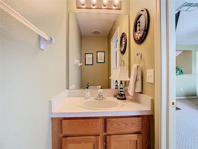 bathroom with vanity and visible vents