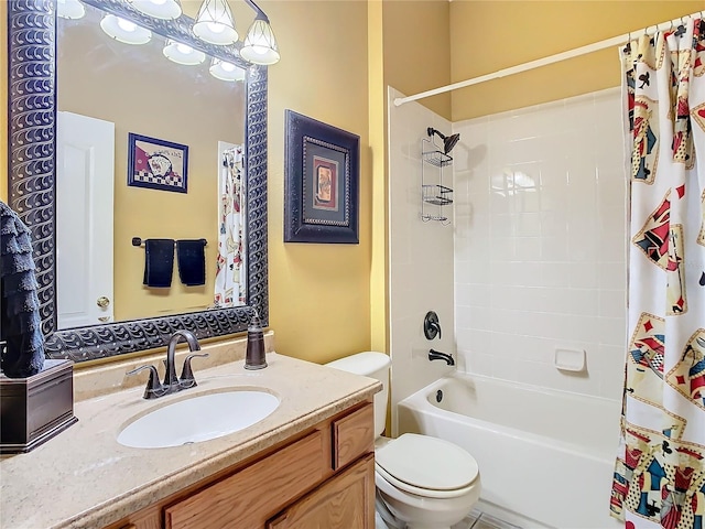 bathroom with shower / tub combo, vanity, and toilet