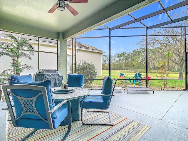 sunroom / solarium with a ceiling fan