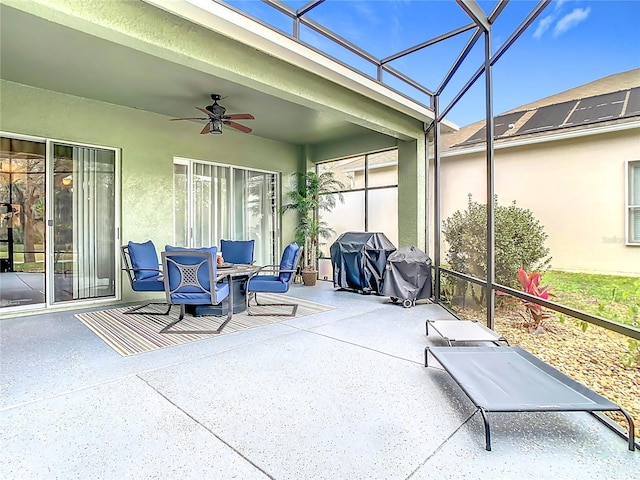 sunroom with a ceiling fan