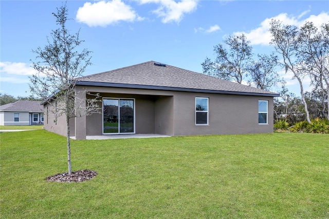 back of property with a patio and a lawn