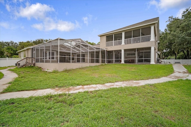 back of property featuring a lawn