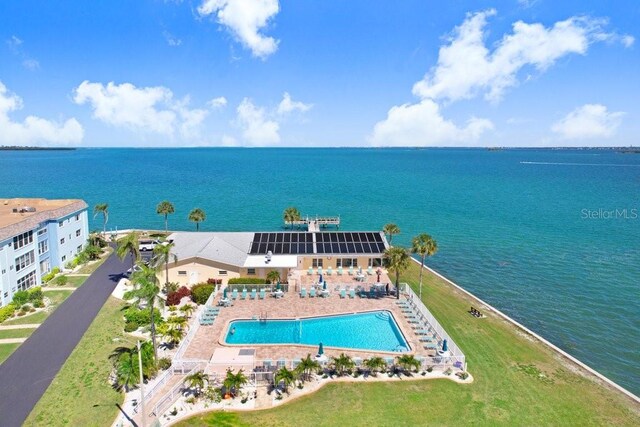 birds eye view of property with a water view