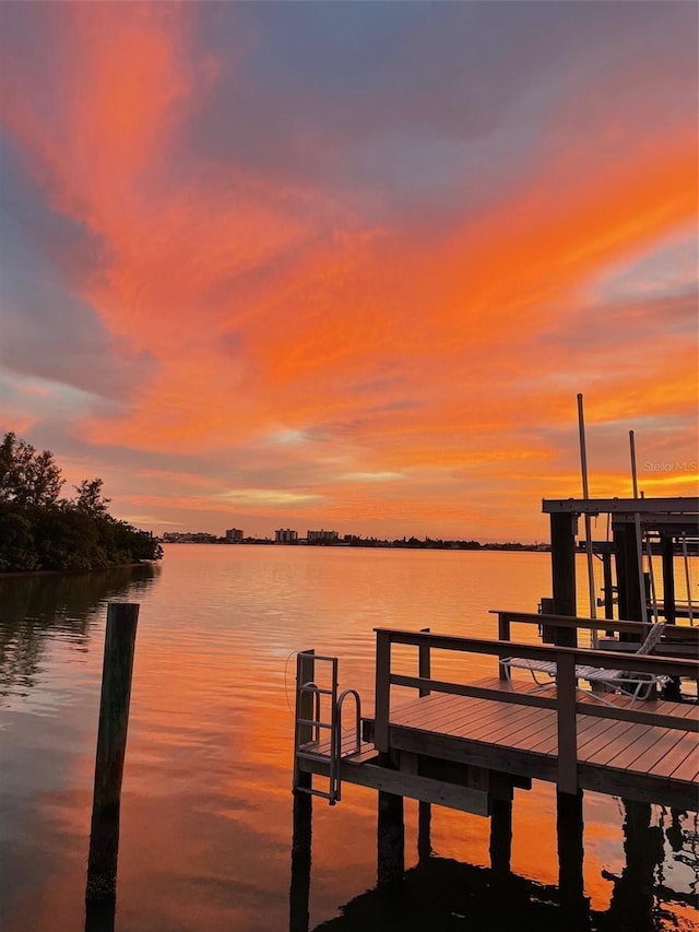 dock area featuring a water view and boat lift