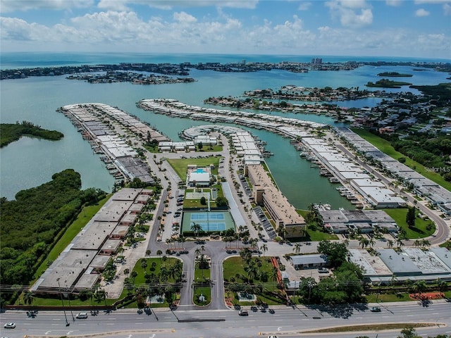 birds eye view of property with a water view