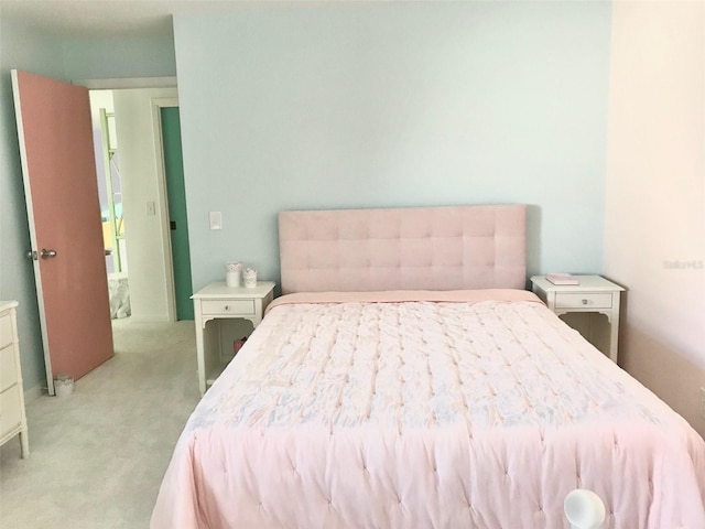 bedroom with light colored carpet